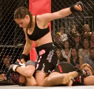 Image 19Gina Carano applying a ground-and-pound on her opponent (from Mixed martial arts)