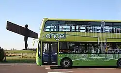 Angel of the North statue with a green Go North East Angel bus