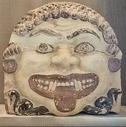 Fig. 17 Gorgoneion with earrings; terracotta antefix from the Acropolis of Athens, Acropolis Museum 78–87, K 292–29 (second half of the sixth century BC)[89]