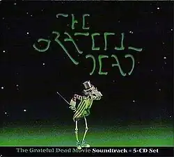 A bowing skeleton wearing an Uncle Sam hat and coat and sneakers and holding a cane, with a hand to its hat as if prepared to tip it