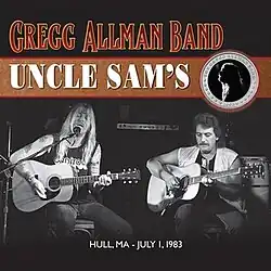 Gregg Allman and Dan Toler, playing acoustic guitars