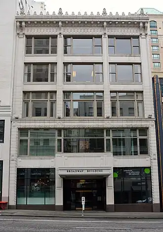 Photograph of a five-story downtown office building.