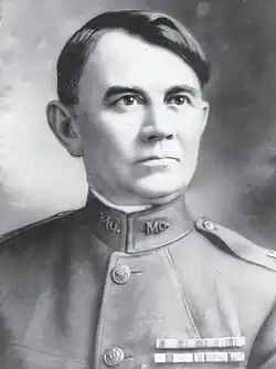 Black and white reproduction of head and shoulders portrait of Brigadier General Harvey C. Clark in dress uniform
