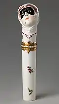 "Toy" needlecase with the head of Columbina, c. 1760, height: 4+7⁄8 inches (12 cm). Inscribed on enamel band on mount: NE SOYEZ POINT CRUELE ("Don't be so cruel")
