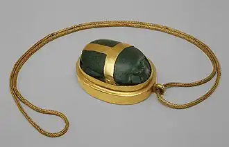 Heart scarab of Hatnefer; 1492–1473 BC; serpentine (the scarab) and gold; 5.3 × 2.8 cm; chain: 77.5 cm; Metropolitan Museum of Art