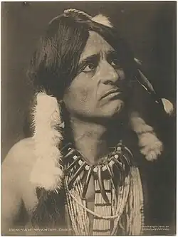 Man in feathered Indian headdress