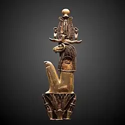 Amulet in the form of Heryshaf seated on a lotus; 1069–332 BC; gold; height: 11.5 cm, width: 3.4 cm; Louvre