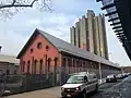 Tracey Towers from Jerome Avenue, with the red-bricked High Pumping Station in the foreground.