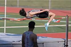 Image 17A high school student attempting to high jump while using the Fosbury Flop technique (from Track and field)