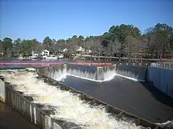 A labyrinth spillway and a fish ladder (left) of the Hope Mills Dam in North Carolina