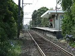 Southbound view of the former ground level Platform 2 and station building, December 2012