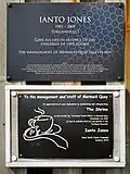 The plaque added by Mermaid Quay management, and a plaque by the Save Ianto Jones campaign.