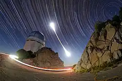 Star trails captured during a total lunar eclipse.
