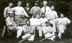 A black and white photo of a cricket team