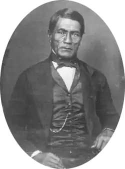 Hawaiian man in western Victorian formal suit