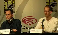 A picture of Jonas Rivera and Pete Docter speaking to an audience.