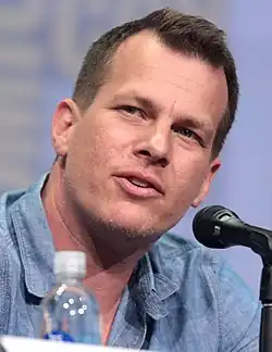 Jonathan Nolan looking to his left