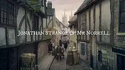 Series title over a 19th century street scene