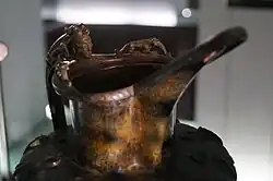 A face on the lip of the Dürrnberg beaked jug [de], Keltenmuseum.