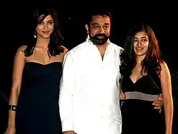 Haasan in white, next to daughters Shruti and Akshara, dressed in black