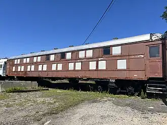 Red railway car with two levels of windows
