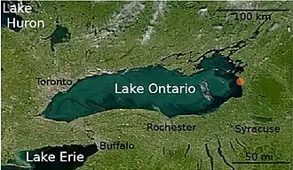 Satellite photograph of Lake Ontario. The cities of Syracuse, Rochester, Buffalo, and Toronto are labeled.