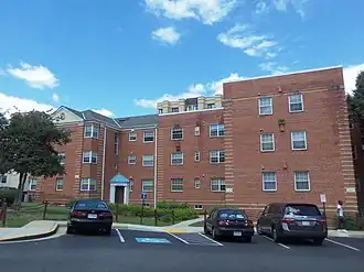 The Lee Gardens North was designed by Mesrobian under standards promoted by the FHA. The brick buildings are in Colonial Revival style, with some influence of Art Deco and Moderne.