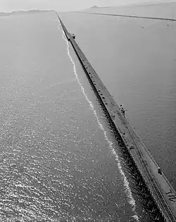 Aerial view of the Lucin Cutoff railway trestle in Utah, U.S.A., before removal. The 1950s causeway is visible to its right.