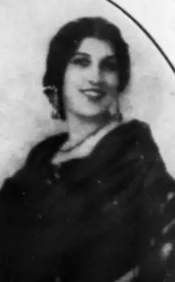 A smiling young woman with dark hair and eyes.