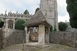 Lych Gate, flanking walls and gates on north side of Church of St Peter and St Paul