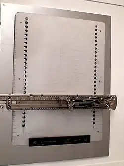 sliding carriage with keys on a metal plate