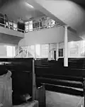 Main meeting room, prior to relocation. The offices in the balcony were built for AFSC.
