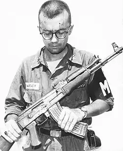 A US Army MP inspects a Chinese AK-47 recovered in Vietnam, 1968