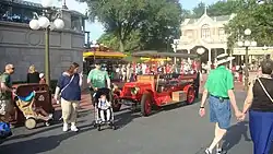 A red turn-of-the-20th-century-style car