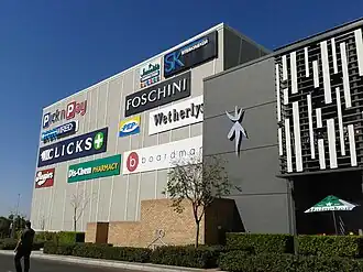 Entrance displaying some of the mall's stores