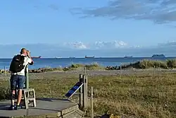 Ship watching using a telescope.