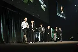 Picture of Pedro Pascal, Sigourney Weaver, Dave Filoni, and Kathleen Kennedy on a stage