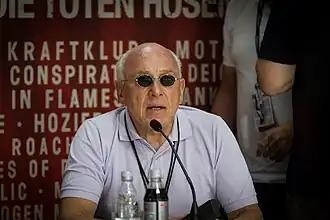 Marek Lieberberg sits and speaks into a microphone