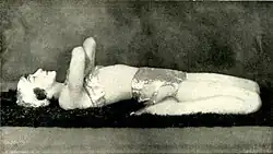 In Supta Virasana, demonstrating "A good exercise for the back and abdominal muscles". Photograph by John de Mirjian, c.&nbsp;1928