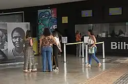 People looking at the image of Maria Felipa.