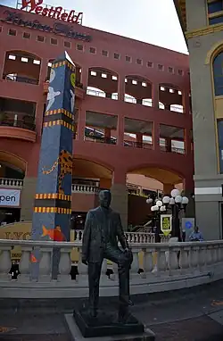 Statue of Ernest W. Hahn and Lyceum Theatre obelisk, near main entrance (2016)
