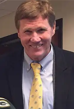 headshot photo of Mark Murphy wearing a suit and Packers tie