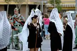 Mantilla made of white lace, during a Holy Week procession in Spain, 2006.
