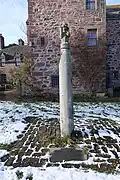 The top of a 17th-century incarnation of the cross, now located in the grounds of Fingask Castle
