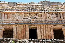 Palace façade on the second level, depicting Ah-Muzen-Cab on the doorway