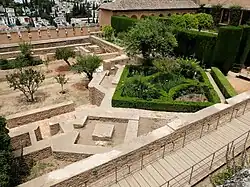 Foundations of the mosque at the southeast corner (now filled by a garden), as well as its minaret (small square structure, lower left)