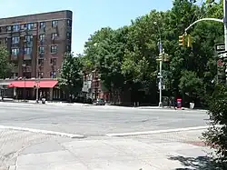 View from Minetta Street looking south across Sixth Avenue at Downing Street; both Minetta Street and Downing Street are built on top of the Minetta Creek riverbed