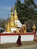 A monk passes through a pagoda