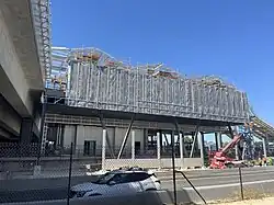 Highway median station under construction viewed from the side