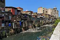 Slum houses next to water